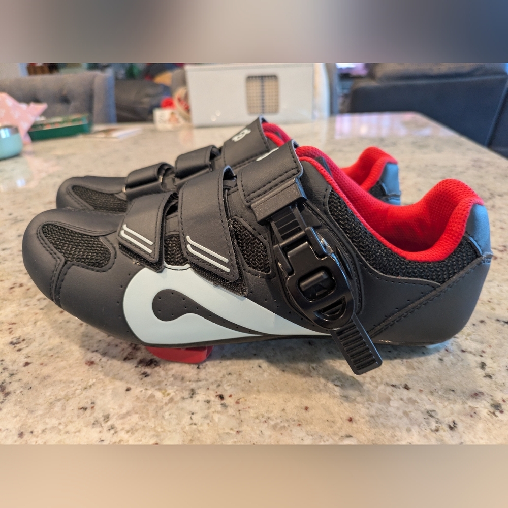 Peloton cycling shoes with hook-and-loop straps and a quick ratchet clip.
